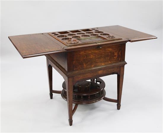 An Edwardian oak surprise table, with retailers label for Mappin & Webb, London, W.2ft .5in.